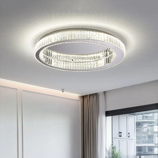 Flush mount crystal chandelier over dining table
