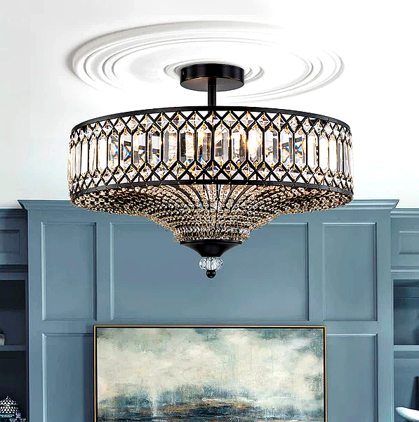 Zeravia chandelier over a modern dining table, showcasing gold metal frame and oval design